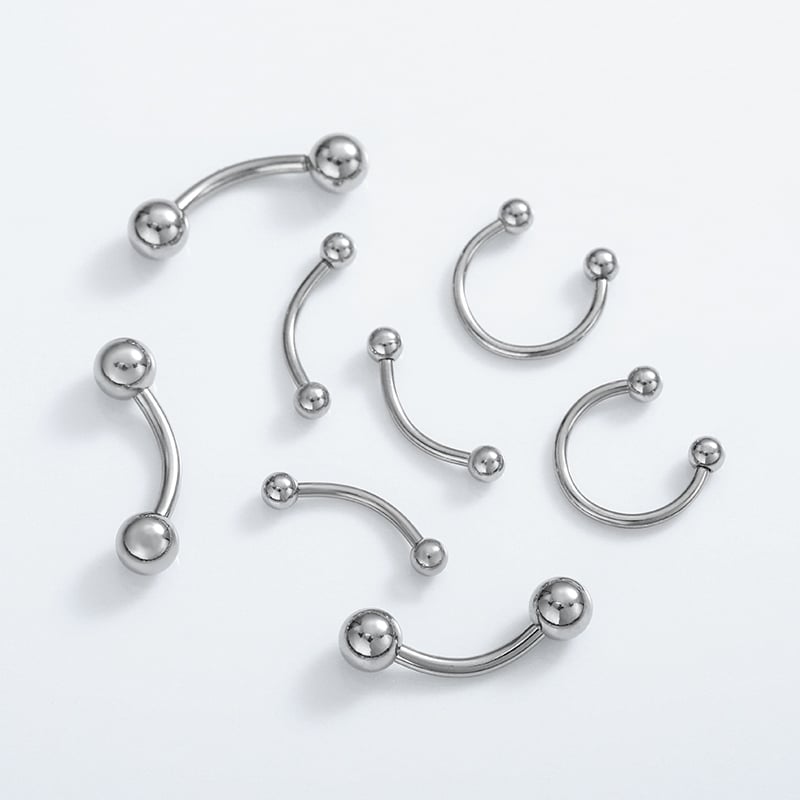 Gold and steel lip jewelry worn on lower lip.jpg