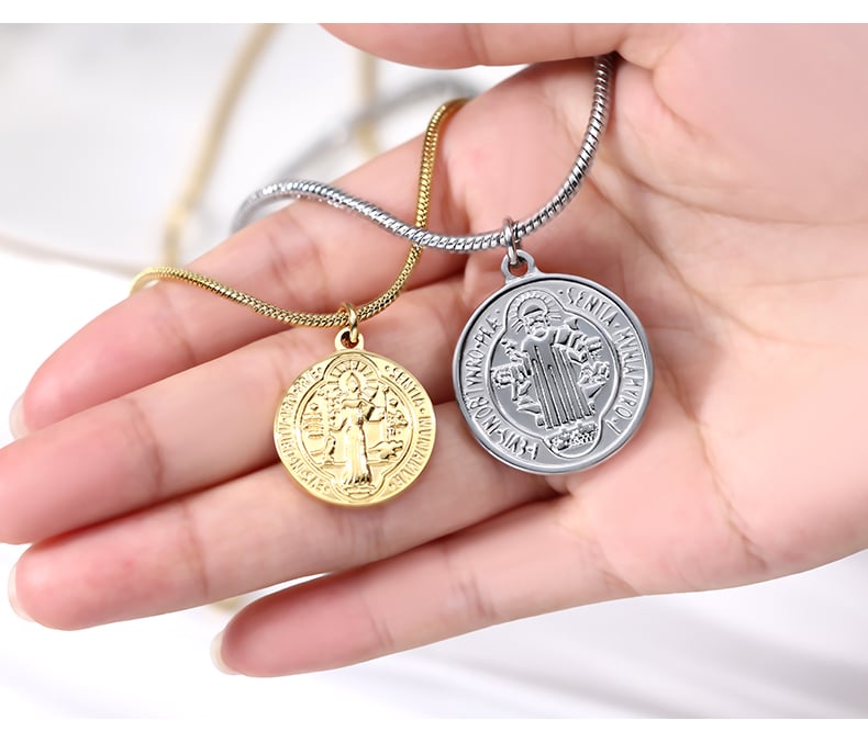 Hand holding gold and steel coin pendant necklaces, product detail.jpg