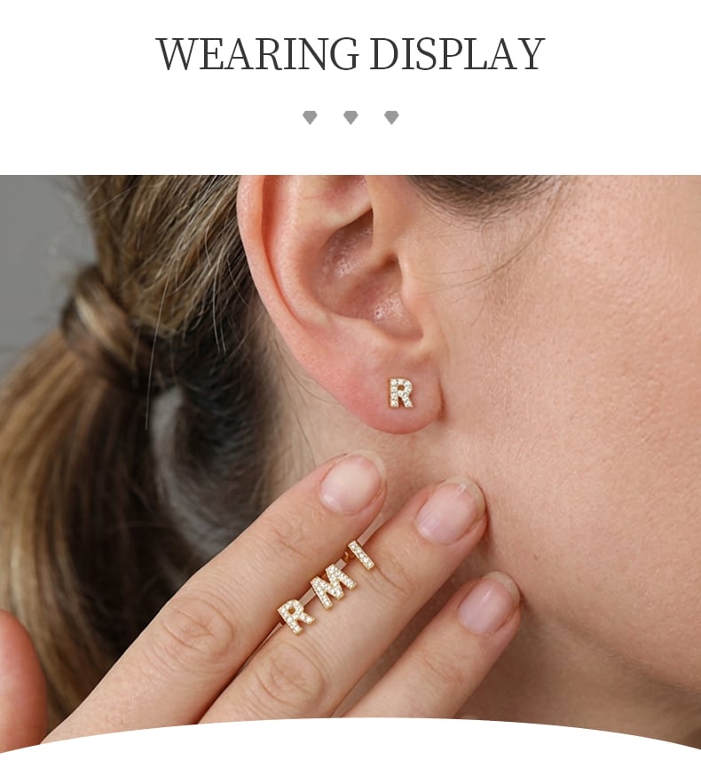 Close view of gold tone letter stud earring with zircon accent.jpg