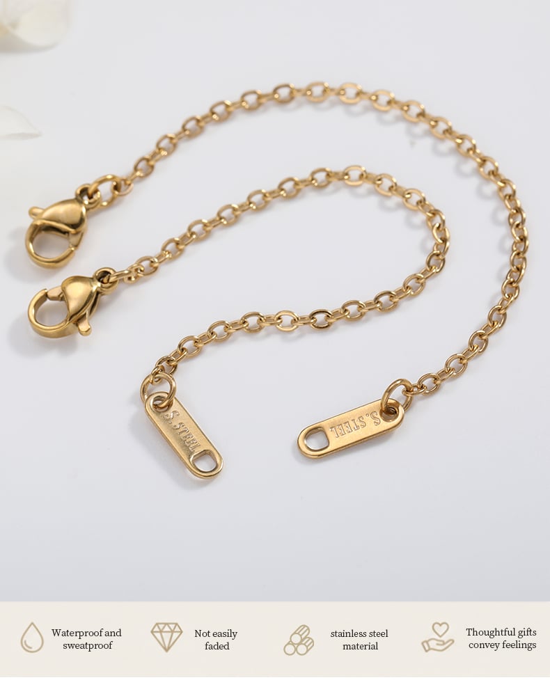 Gold tone extension chain with engraved S.STEEL tag detail.jpg