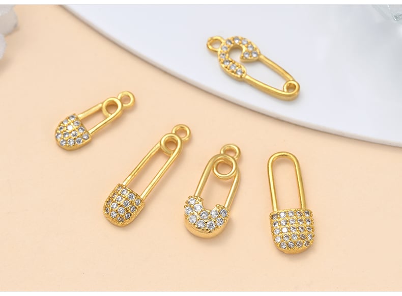 Gold plated CZ pendant charms showcase safety pin celestial designs13.jpg