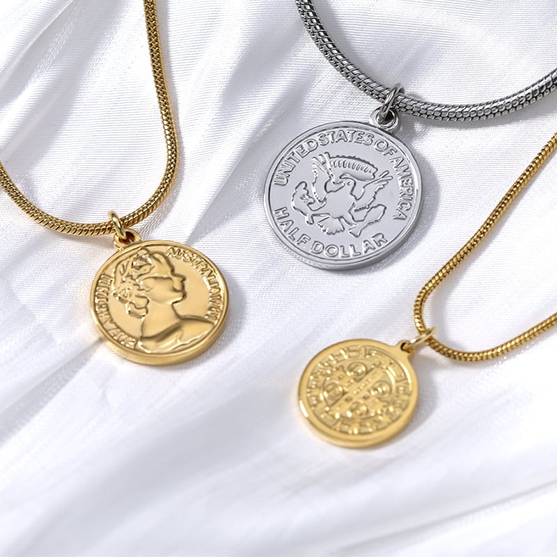 Custom gold coin pendant necklace with box chain, close-up on fabric.jpg