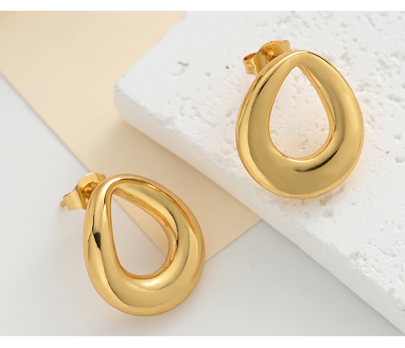 Geometric hollow stud earrings on transparent background.jpg