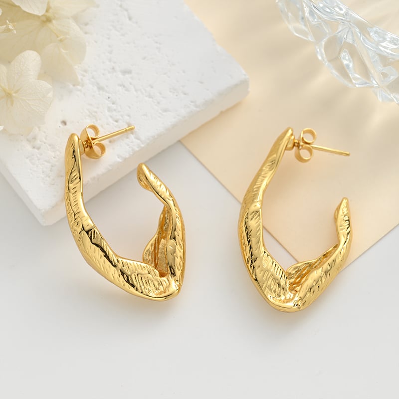Geometric hollow stud earrings worn in daily styling.jpg