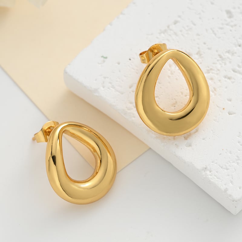 Geometric hollow stud earrings styled for office wear.jpg