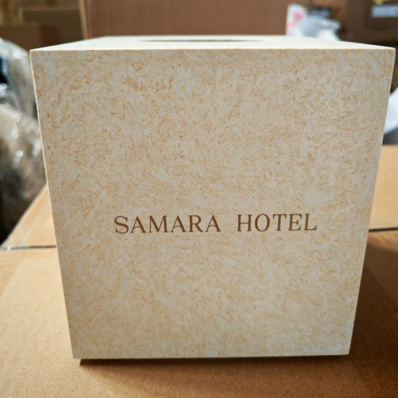 Custom beige faux-stone square tissue box cover branded with embossed SAMARA HOTEL logo for guestroom amenities..jpg