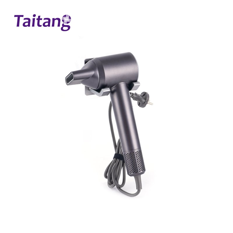 Taitang dark grey hotel hair dryer with nozzle attachment stored in a wall-mounted metal bracket, showing the coiled power cord and plug..jpg