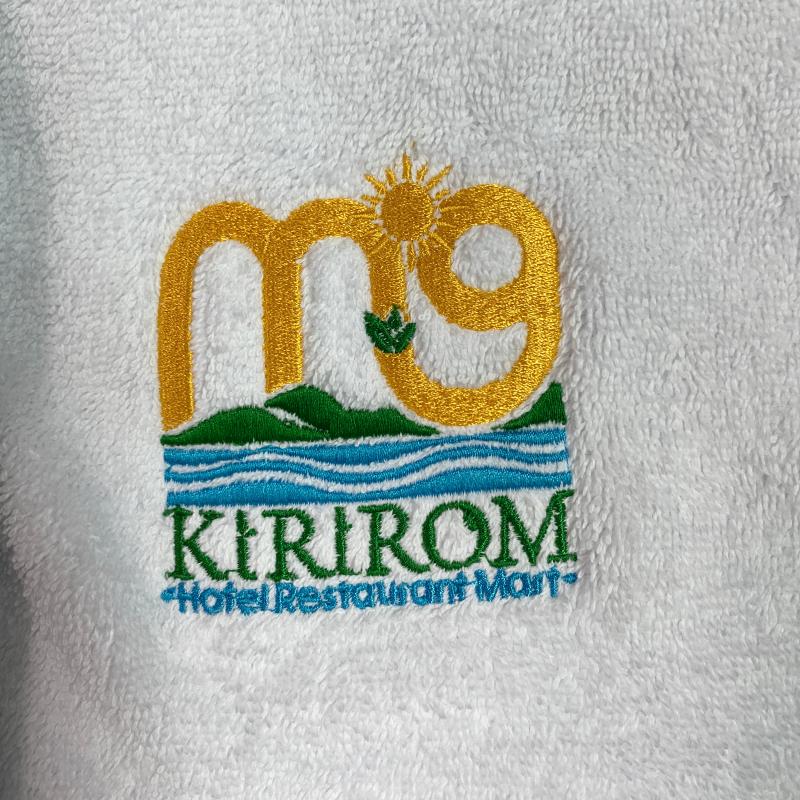 Custom multi-color embroidered logo on plush white commercial hotel bath towel.JPG