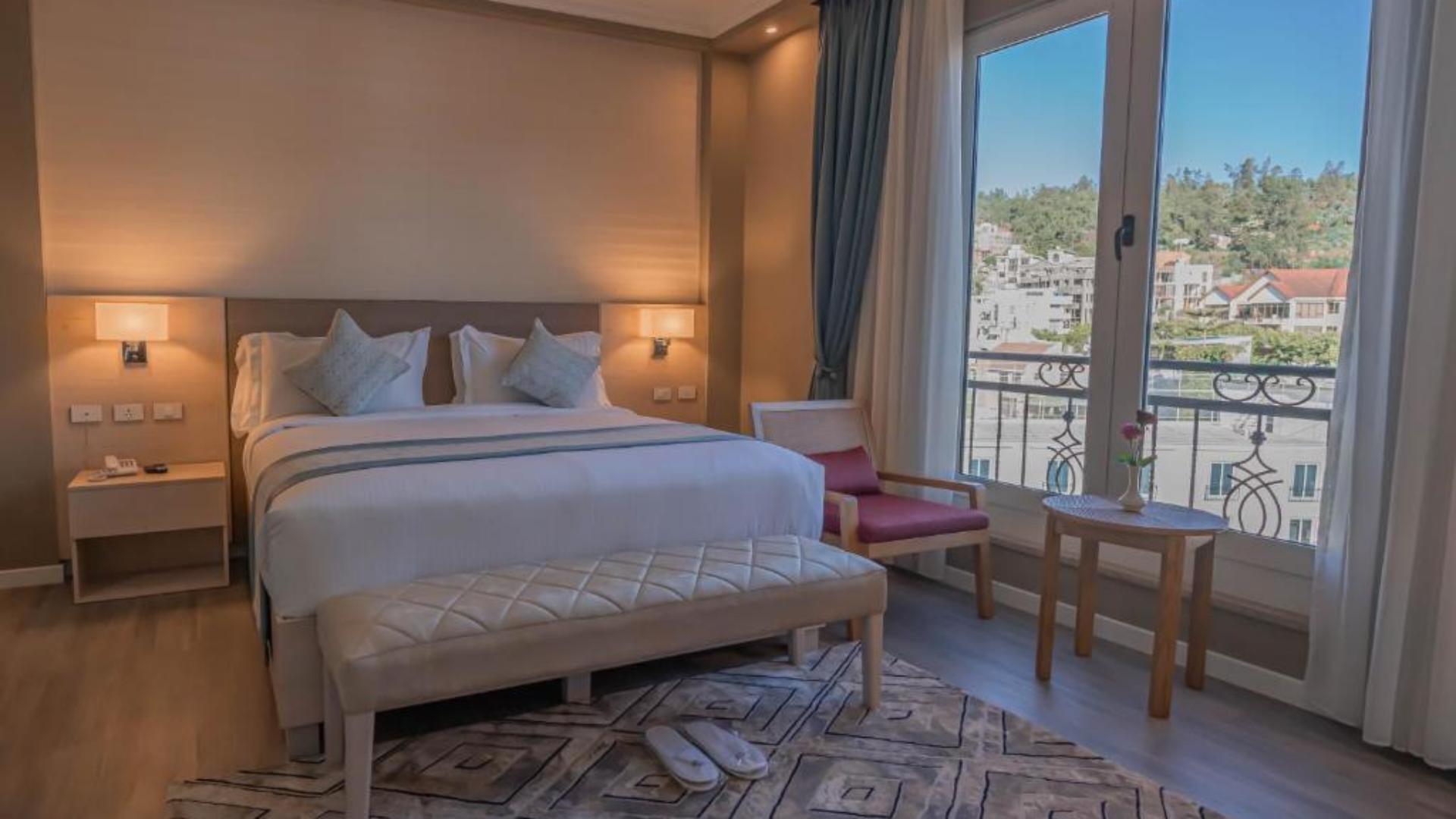 Premium 5-star hotel bedding and luxury guestroom linens supplied by Taitang in a modern executive suite at Haile Grand Addis Ababa.jpg