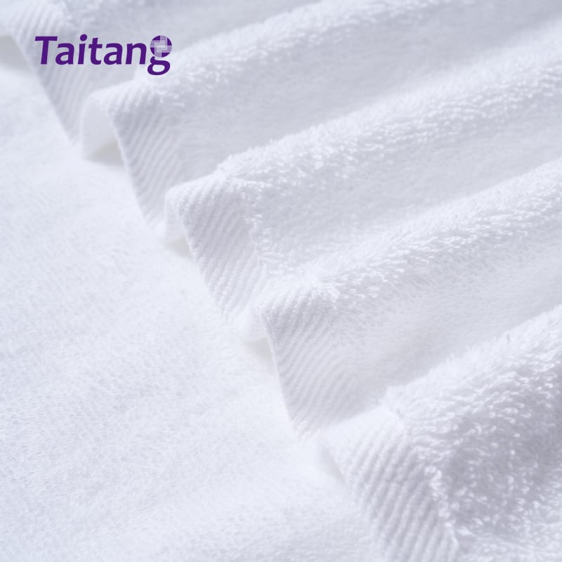 Close-up of double-stitched reinforced hem on commercial luxury white hotel bath towels.jpg