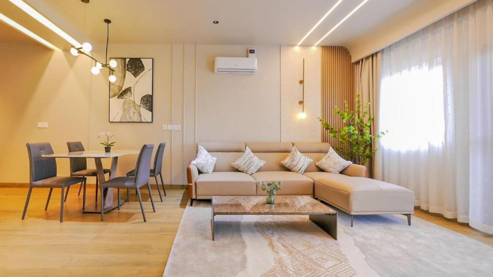 Elegant open-concept living space of a luxury extended-stay suite at Amaltas The View, outfitted through Taitang's 5 star serviced apartment OS&E package.jpg