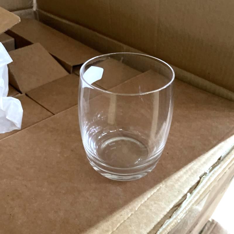 Clear lead-free commercial crystal glass water tumbler undergoing pre-shipment quality check.JPG