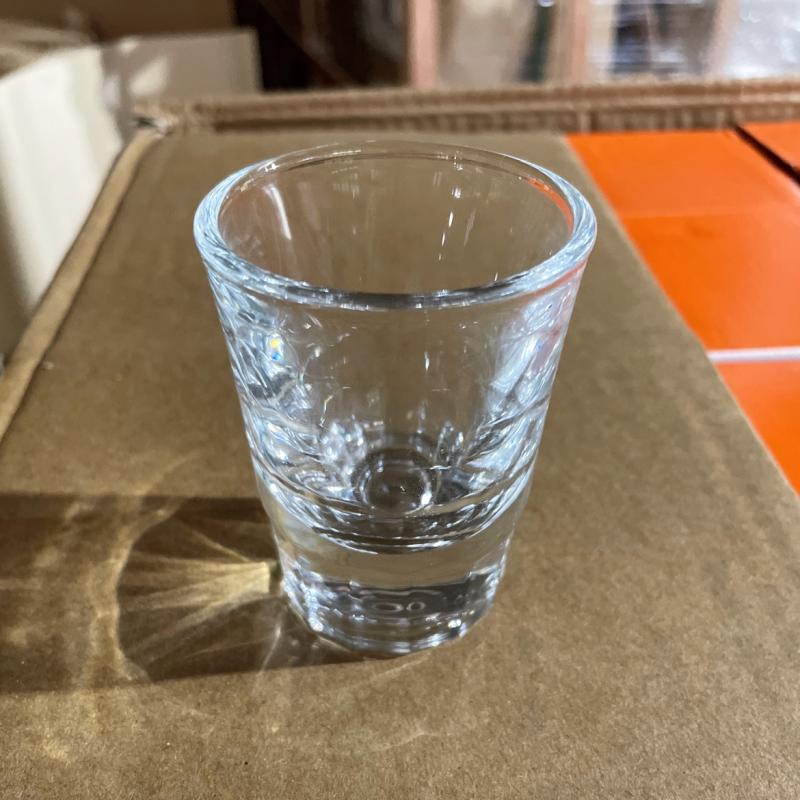 Heavy-base clear glass beverage tumbler with subtle ribbed texture for commercial hotel and resort restaurant use.JPG