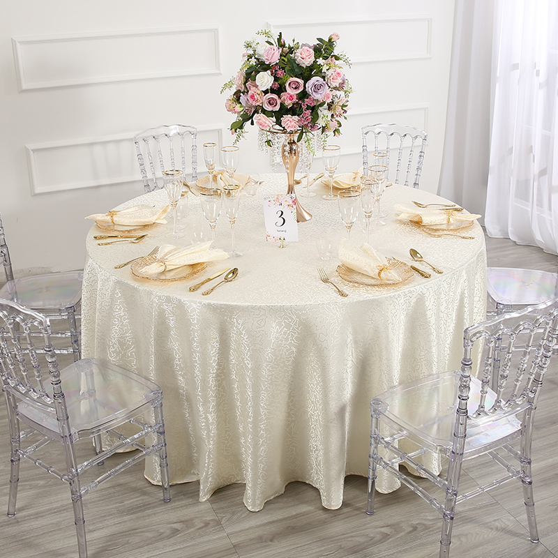 Luxury Round Banquet Table Setup with Taitang Premium Linens and Clear Chairs.jpg