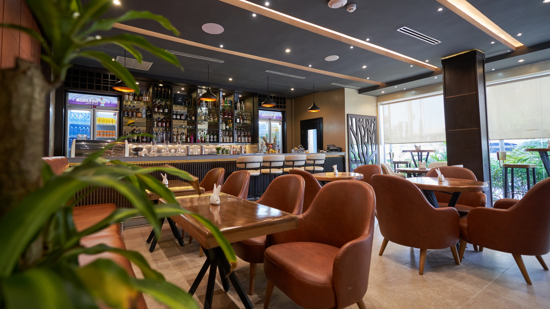 Contemporary hotel lounge and bar dining area at Monty Suites, highlighting Taitang’s one-stop hotel supplies procurement for commercial glassware supplies and restaurant infrastructure.jpg
