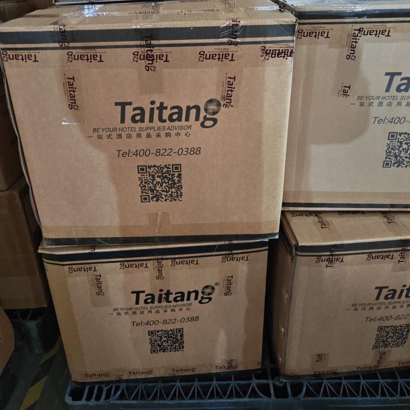 A photo of several stacked brown cardboard shipping boxes in a warehouse, likely on a pallet.jpg