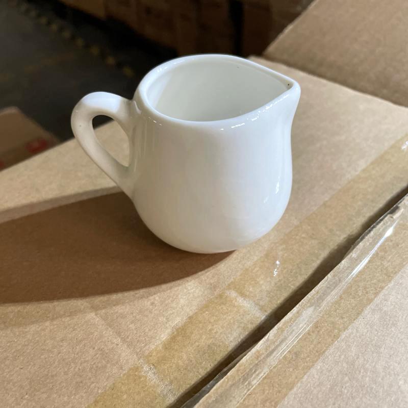 White porcelain milk creamer pitcher for hotel restaurant and cafe breakfast service.JPG