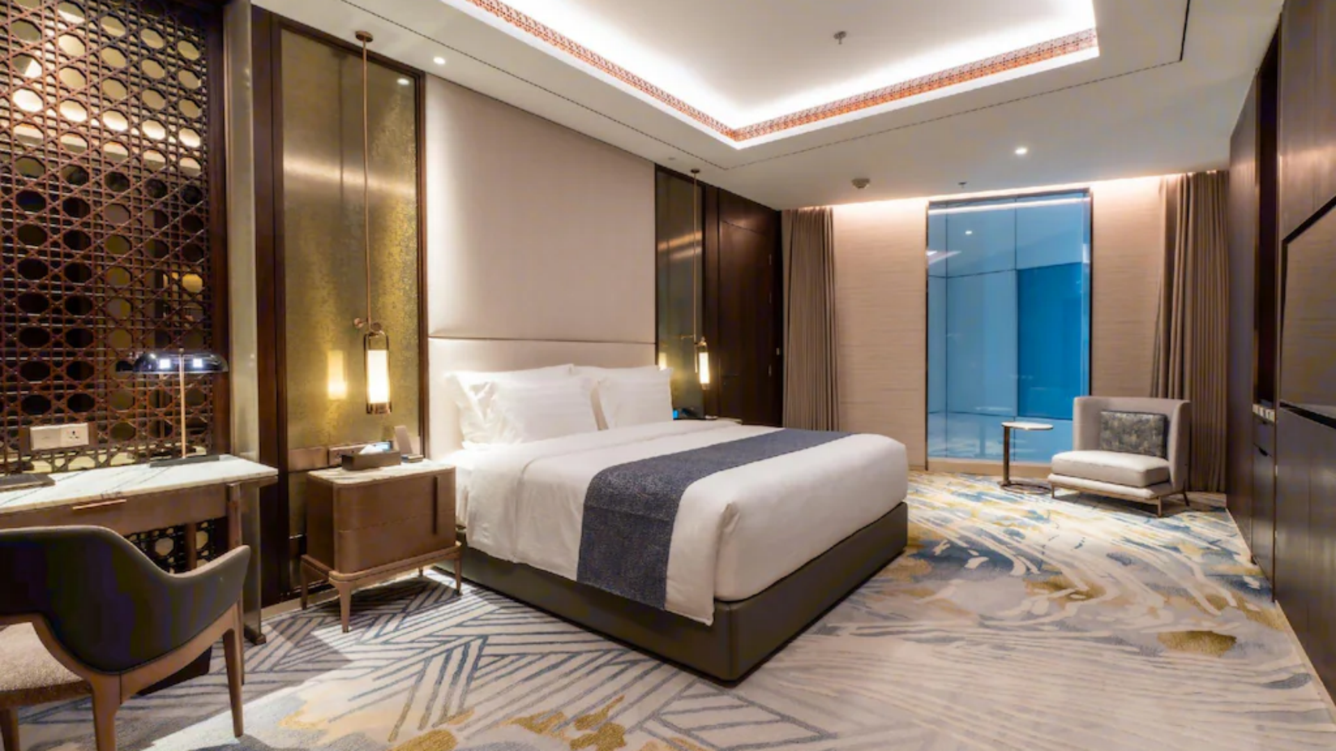 Luxury 5-star executive hotel bedroom suite at Arjuna Solitaire Hotel, displaying resort linens and upscale guestroom accessories from Taitang.jpg