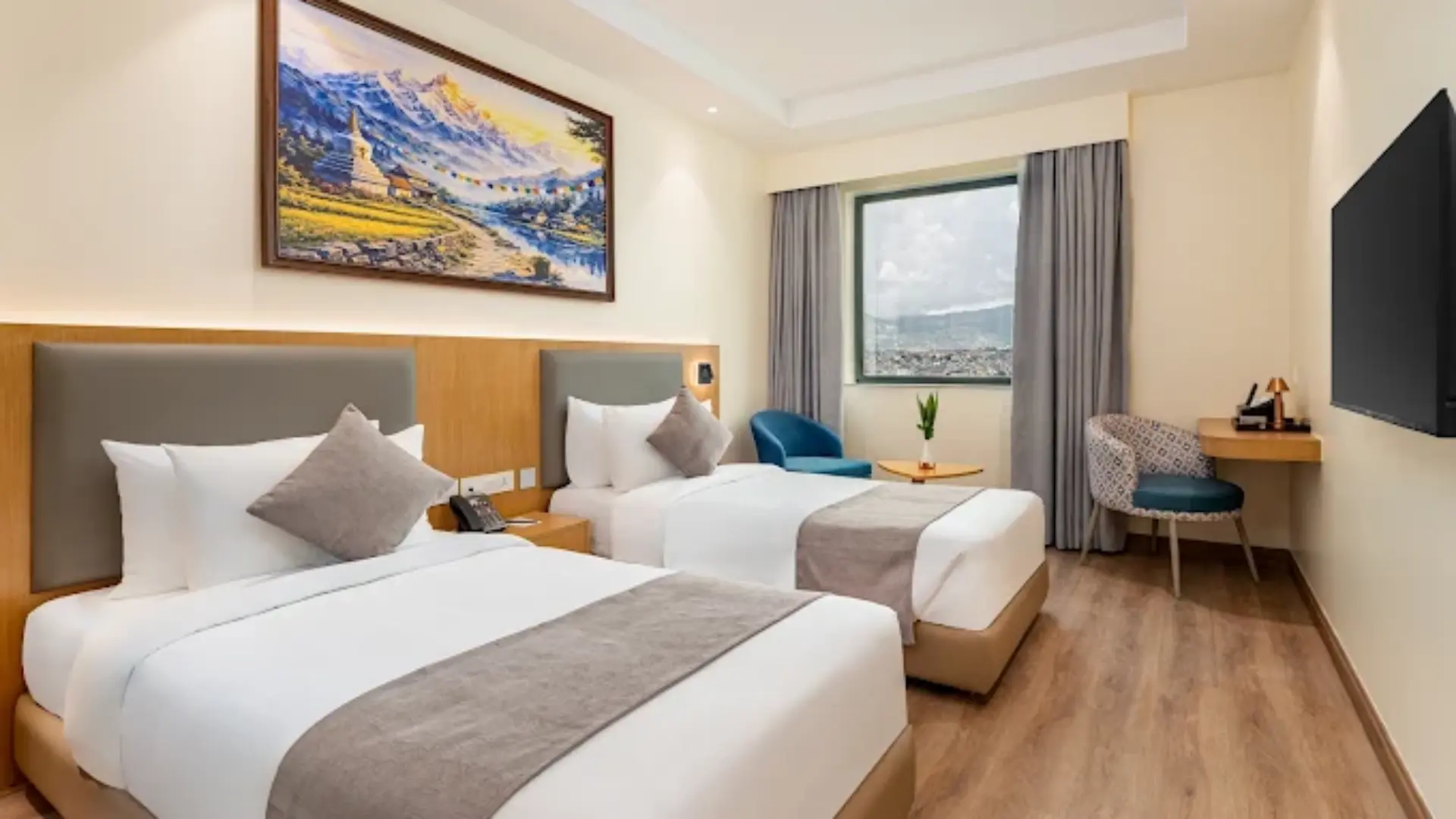 Modern guestroom interior featuring comfortable twin beds and contemporary decor at Hotel DAAAS Kathmandu.webp