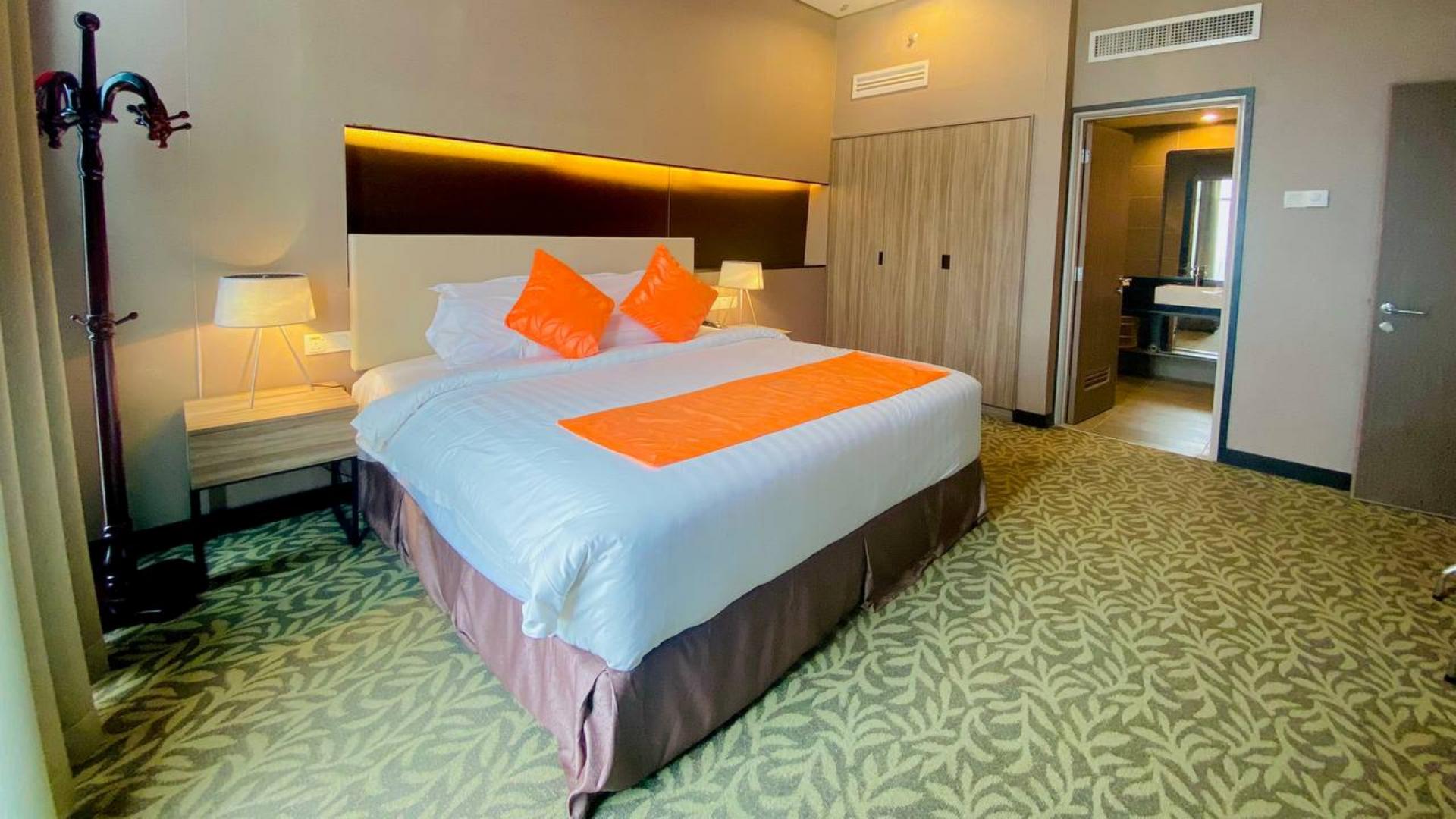 Spacious 4-star executive king guest room at Grand Alora Hotel, beautifully styled with Taitang's premium hotel bedding.jpg