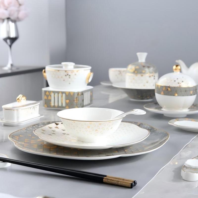 Elegant Taitang bone china dinnerware set with gold detailing, including bowls, plates, and soup tureen for fine dining.jpg