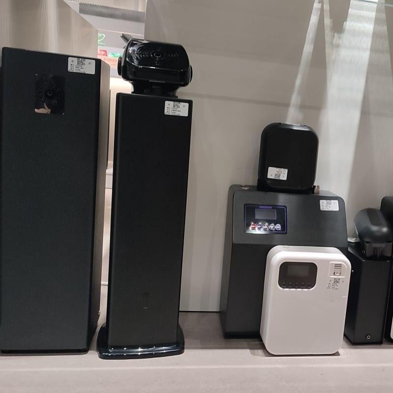 Close-up of Taitang heavy-duty scent diffusion systems and sleek wall-mounted hotel guestroom aromatherapy diffusers.jpg