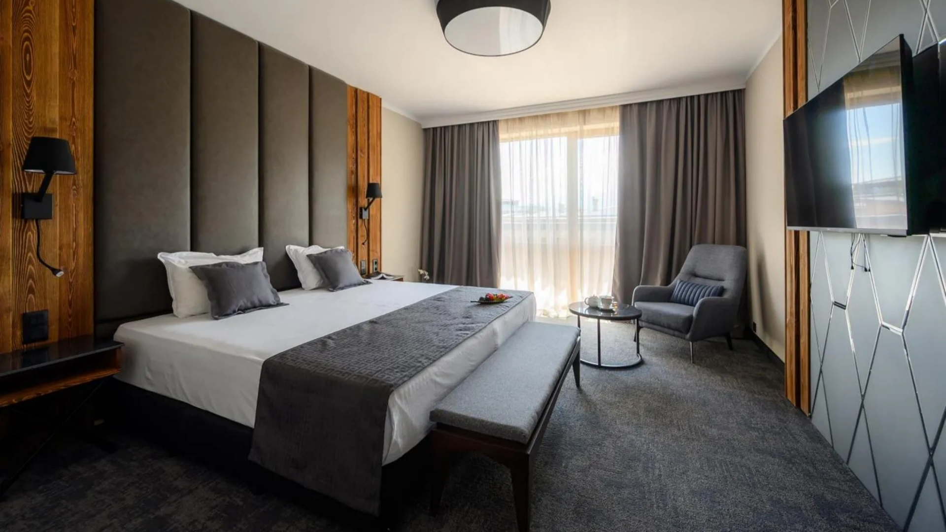 A luxury 5-star hotel executive bedroom interior at Grand Hotel Therme, showcasing premium hotel bedding, high-thread-count crisp white sheets, and coordinated plush grey linens from Taitang.jpg
