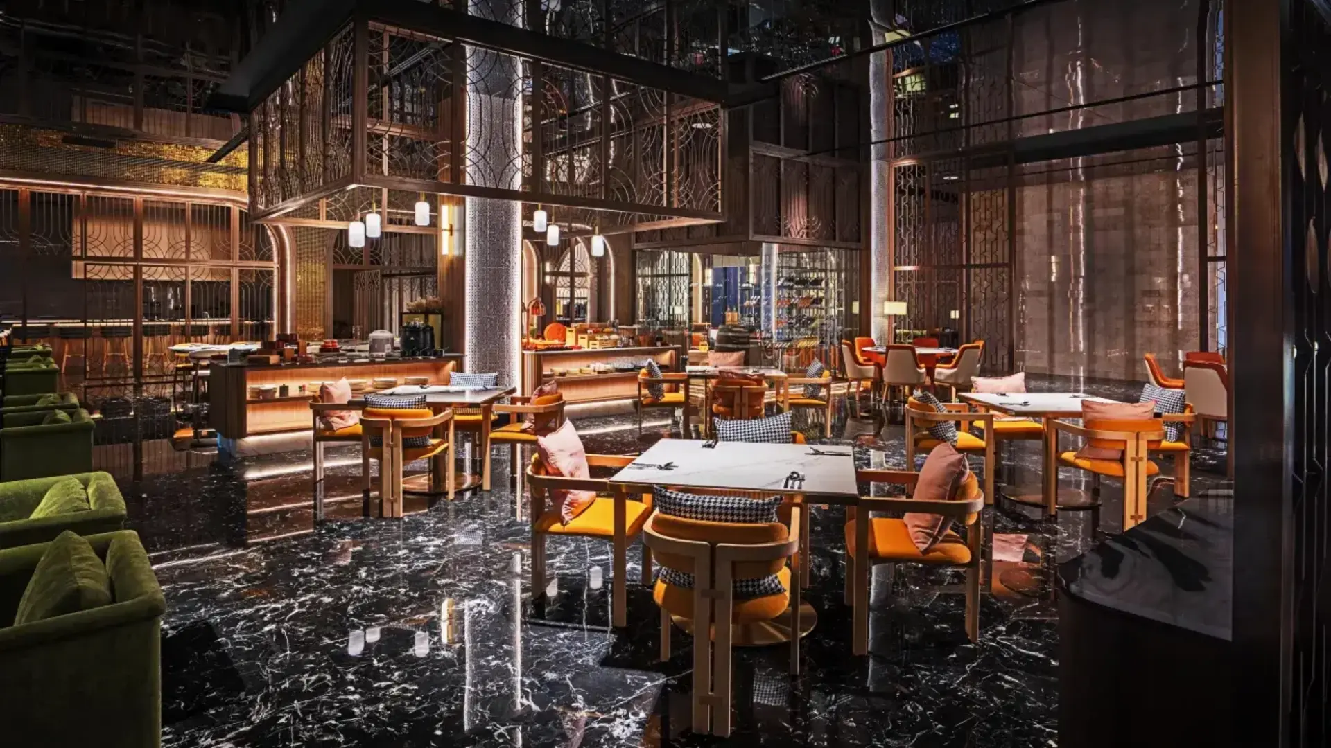 Spacious luxury hotel restaurant interior featuring marble flooring, custom dining tables, and plush upholstered chairs.webp
