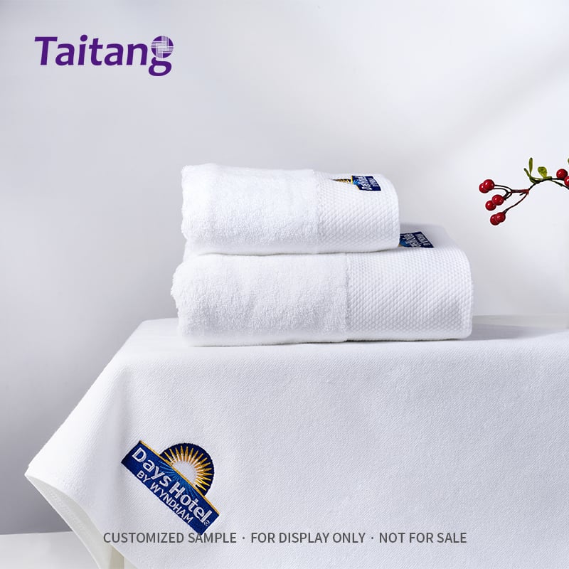 Taitang luxury white hotel towel set with embroidered logo and satin dobby border.jpg