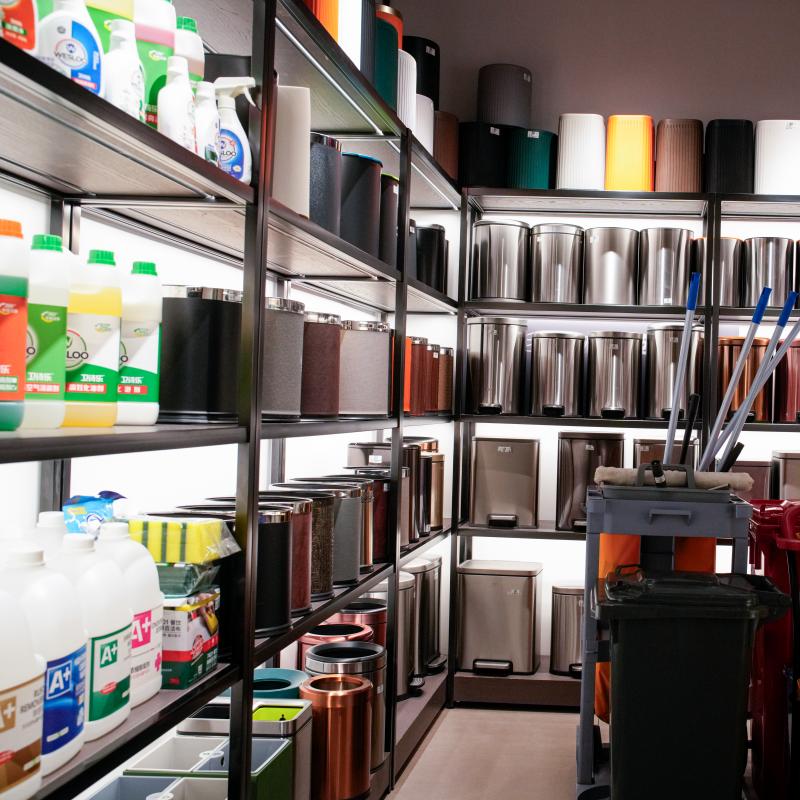 Commercial hotel housekeeping supplies and janitorial cleaning equipment on heavy-duty storage racks for hospitality property maintenance.JPG