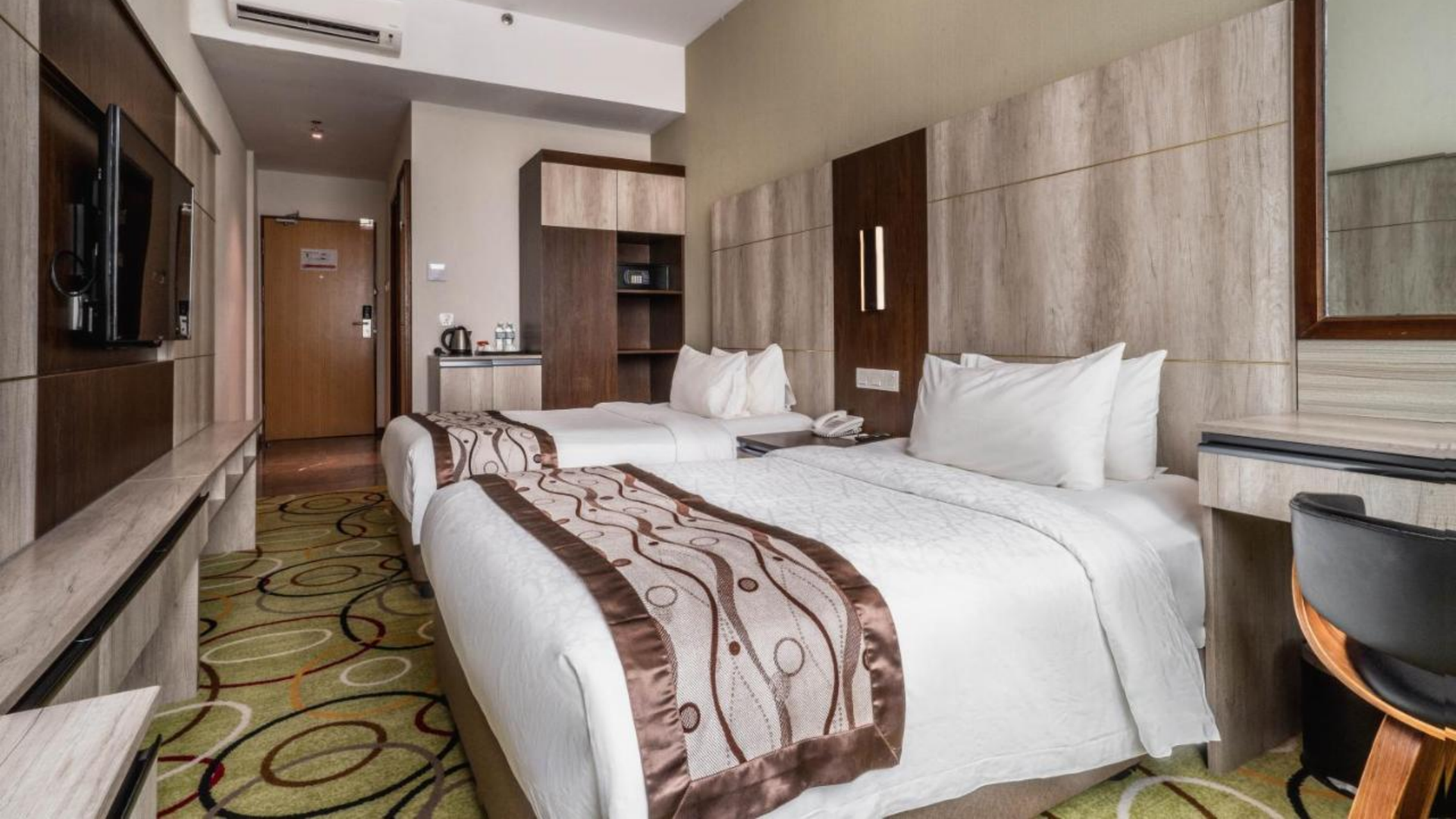 Interior view of a modern twin room at ANO Hotel, displaying two single beds outfitted with premium Taitang hotel bedding.jpg