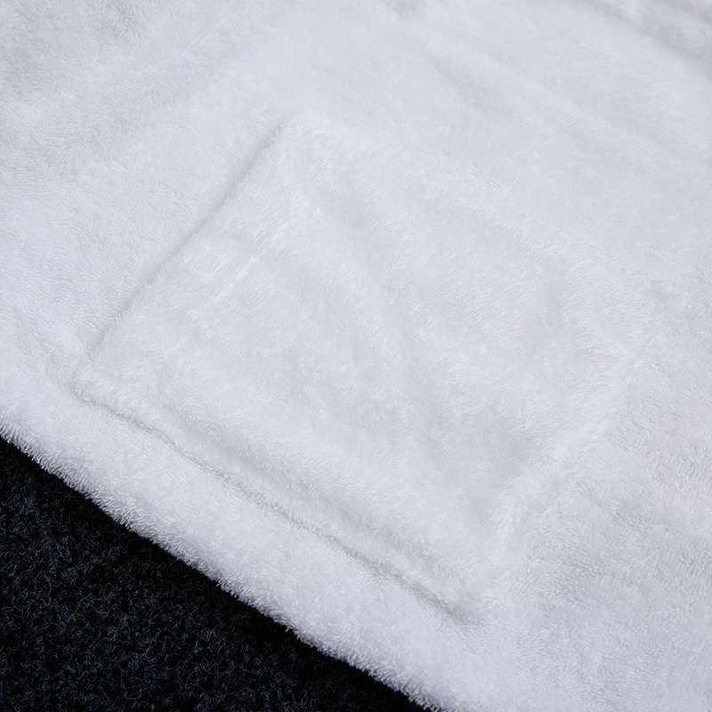 High-definition view of the neatly stitched pocket and dense loop construction of a luxury resort bathrobe.jpg