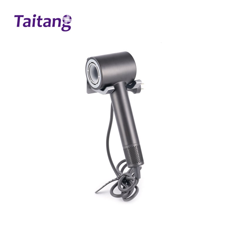 Front angle view of Taitang commercial wall-mounted hair dryer featuring a round air outlet mesh and compact dark grey design for hotel bathrooms..jpg