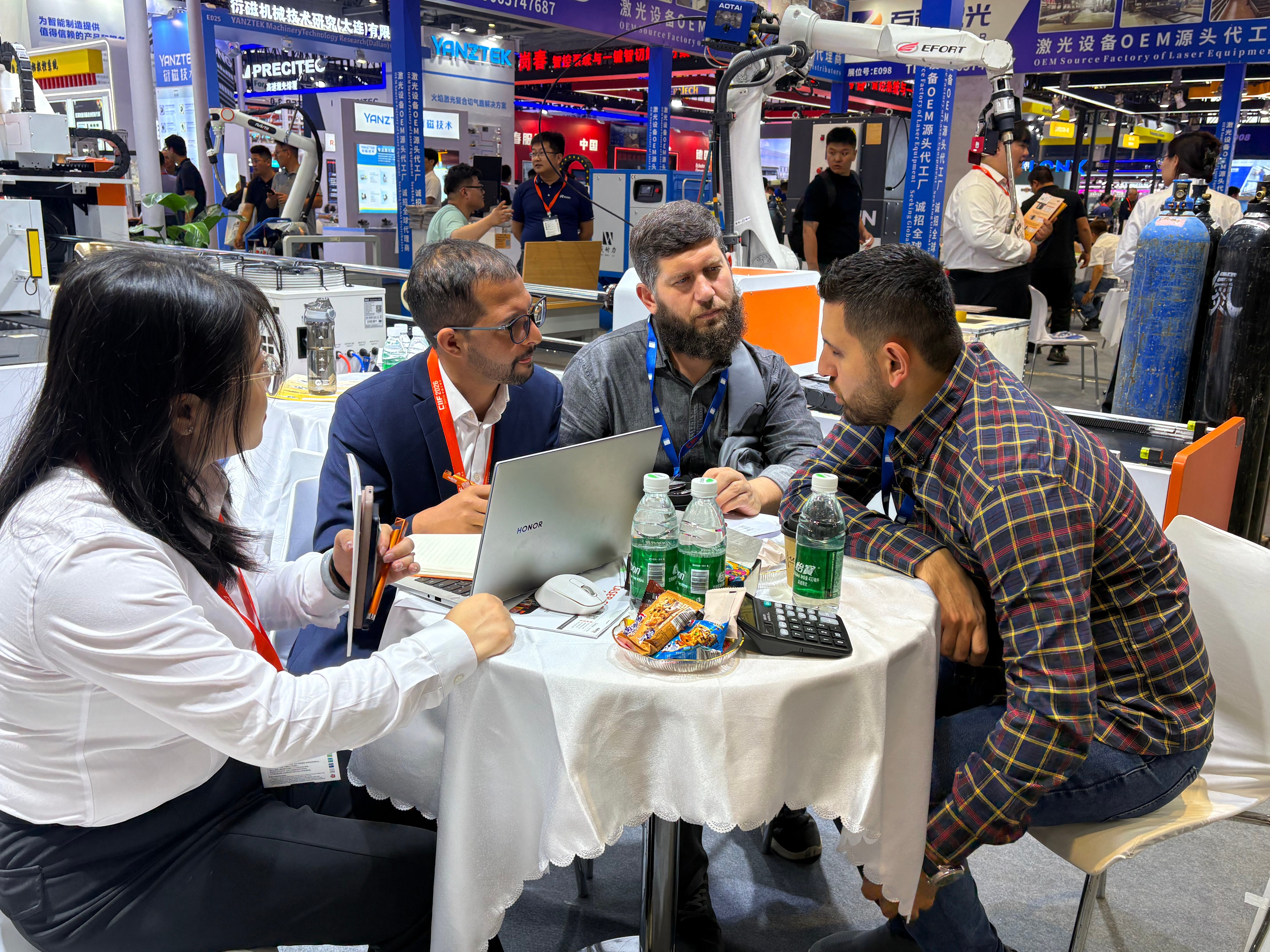 Raytu team member speaking with a visitor at CIIF 2026.jpg