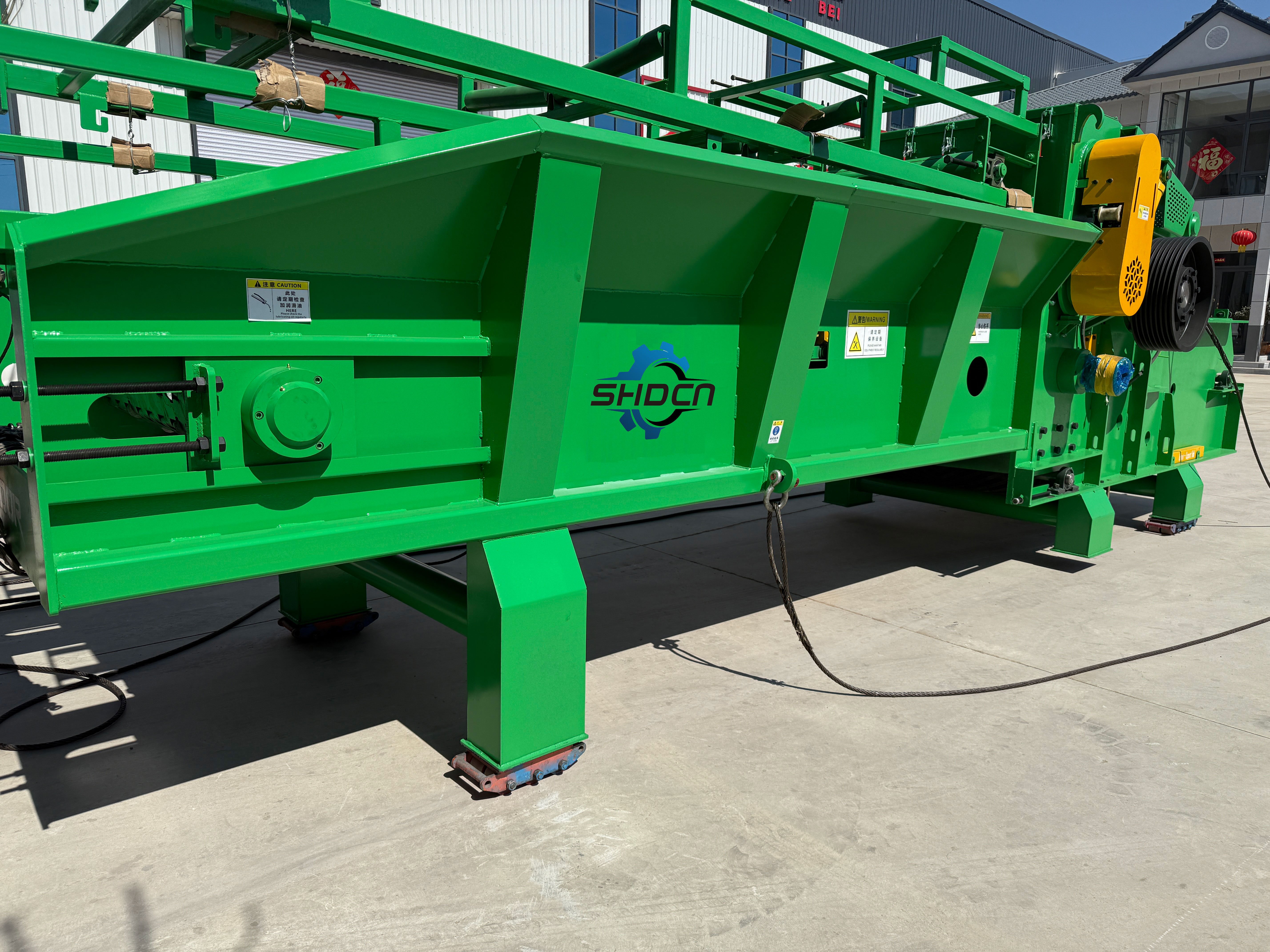 How does a wood crusher improve production efficiency for processing companies?