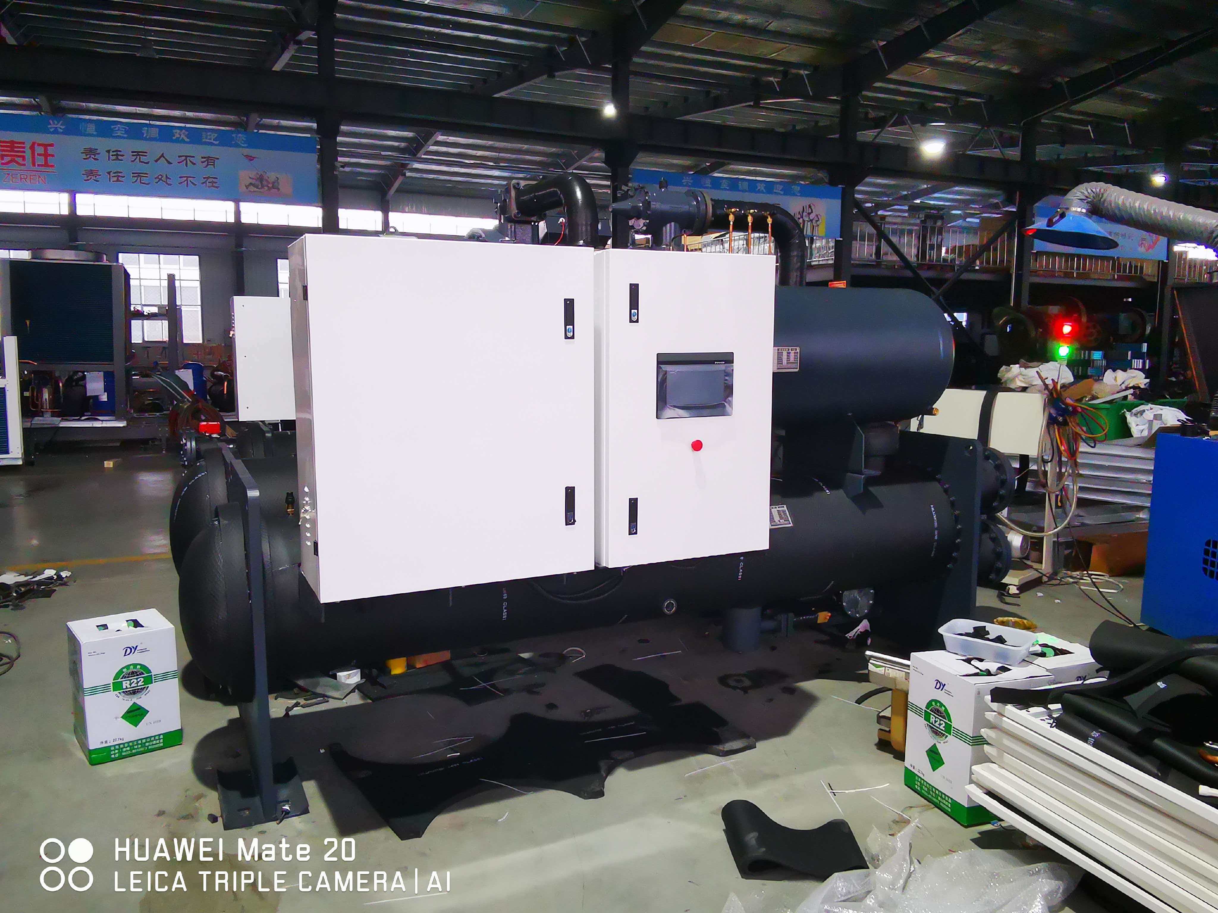 Why use a water-cooled condensing unit in industrial refrigeration plants?