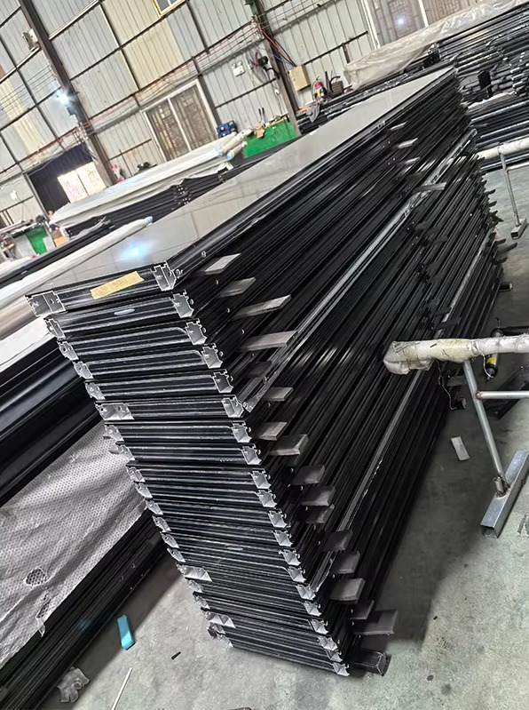 Steel alloy garage door powder coating application and finishing