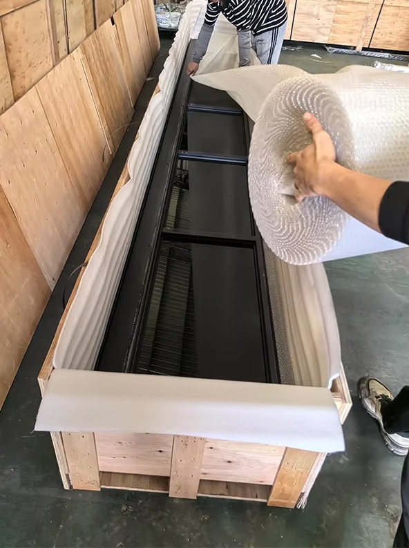 Steel alloy garage door container loading and delivery