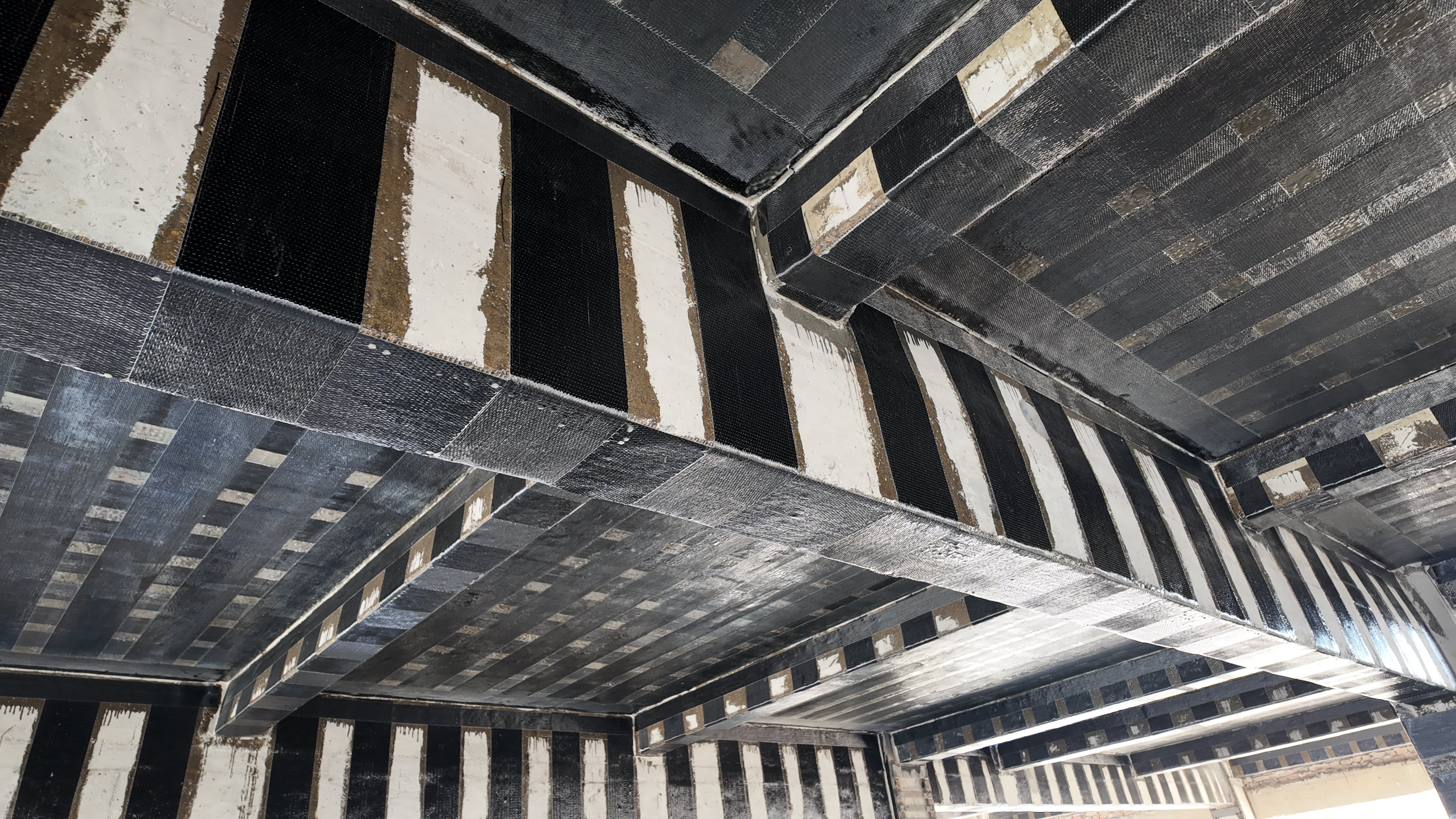 Innovative Application and Outstanding Value of Carbon Fiber Fabric in Reinforcing Cement Concrete Pavement Base Layers