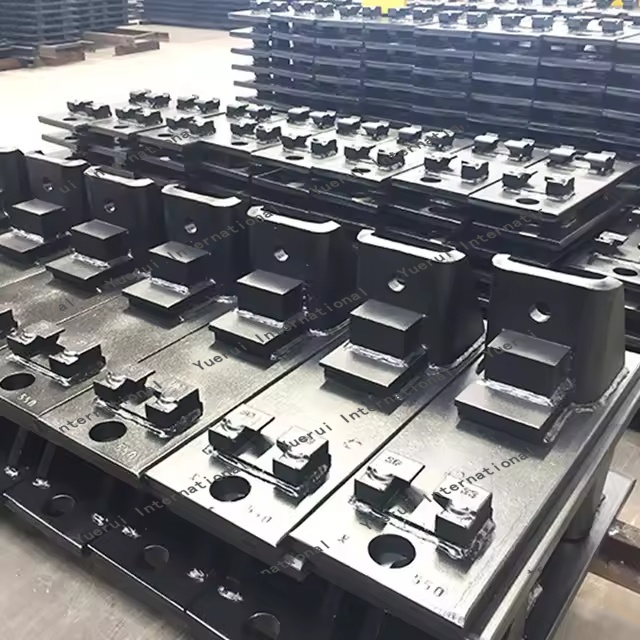 What coatings improve corrosion resistance of base plates in railways?