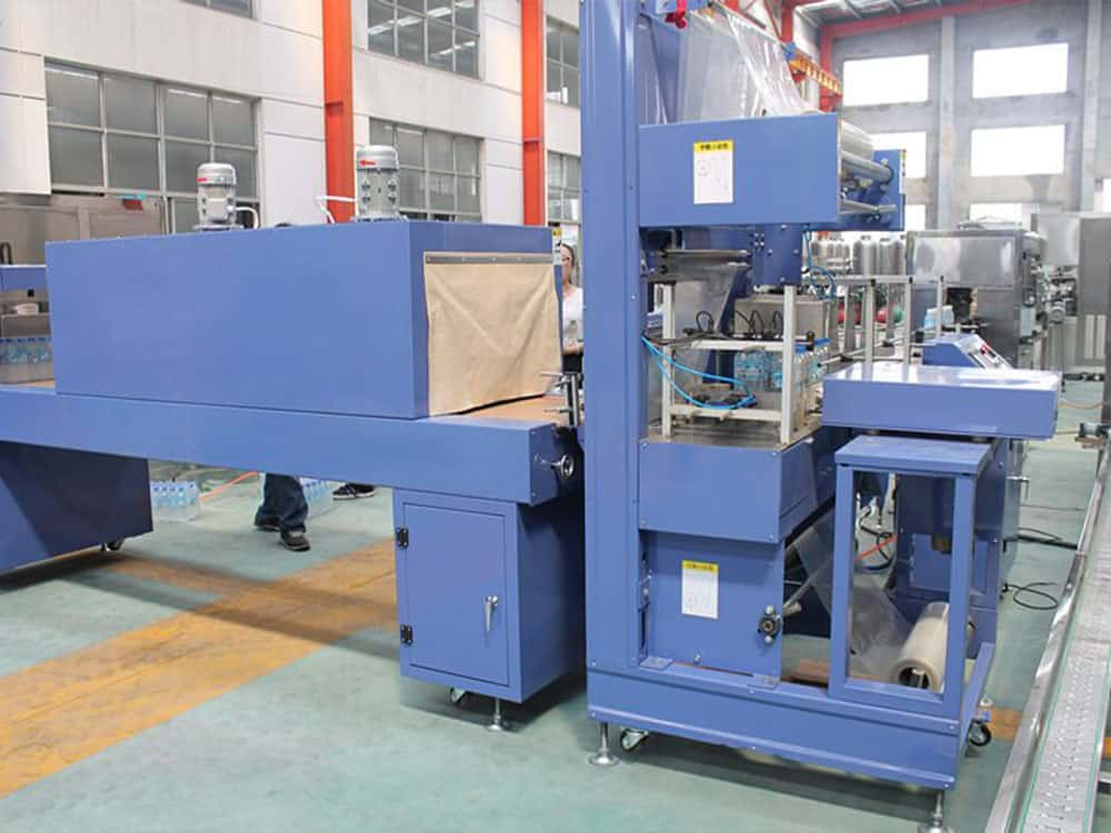 Automatic film shrink wrapping machine