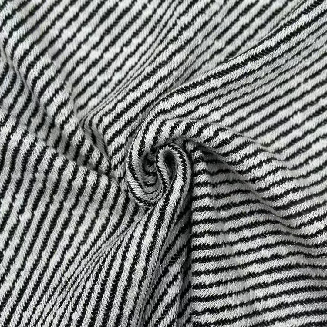 Why is jacquard fabric preferred for high-end textured clothing designs?
