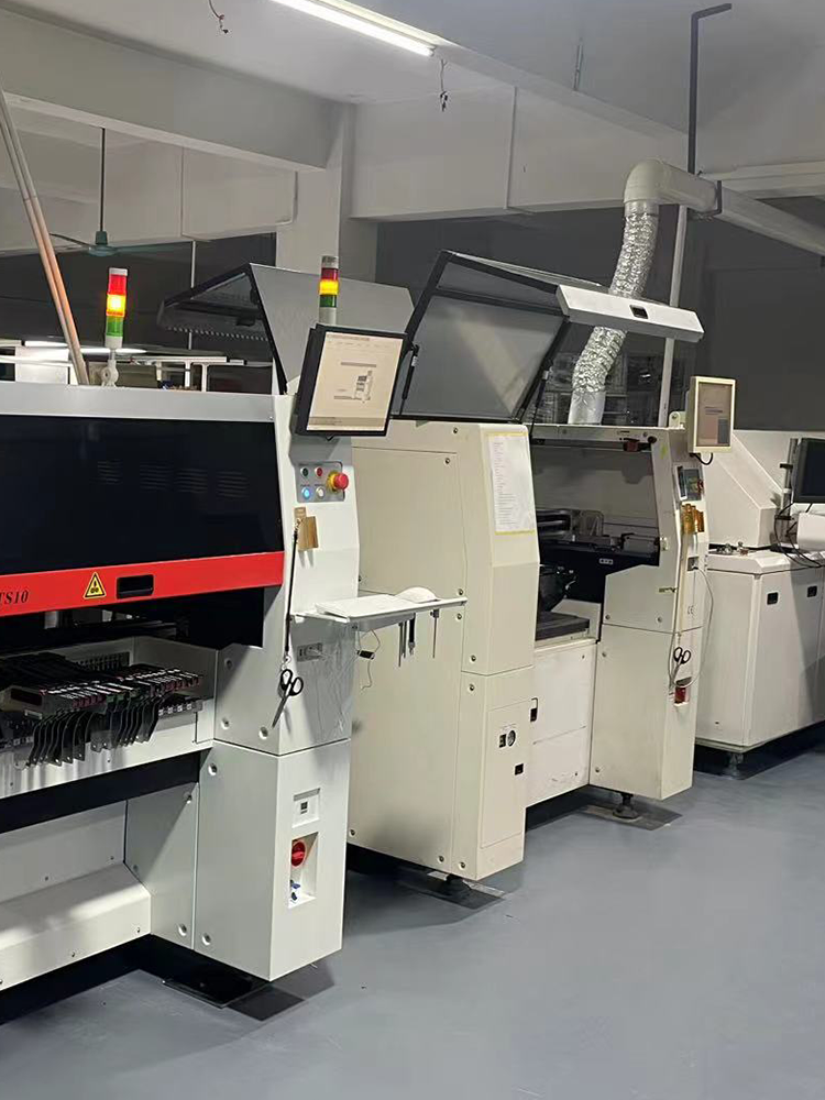 Charmhigh SMT pick and place machine on a workbench assembling electronic components onto a printed circuit board, designed for overseas electronics manufacturing.png