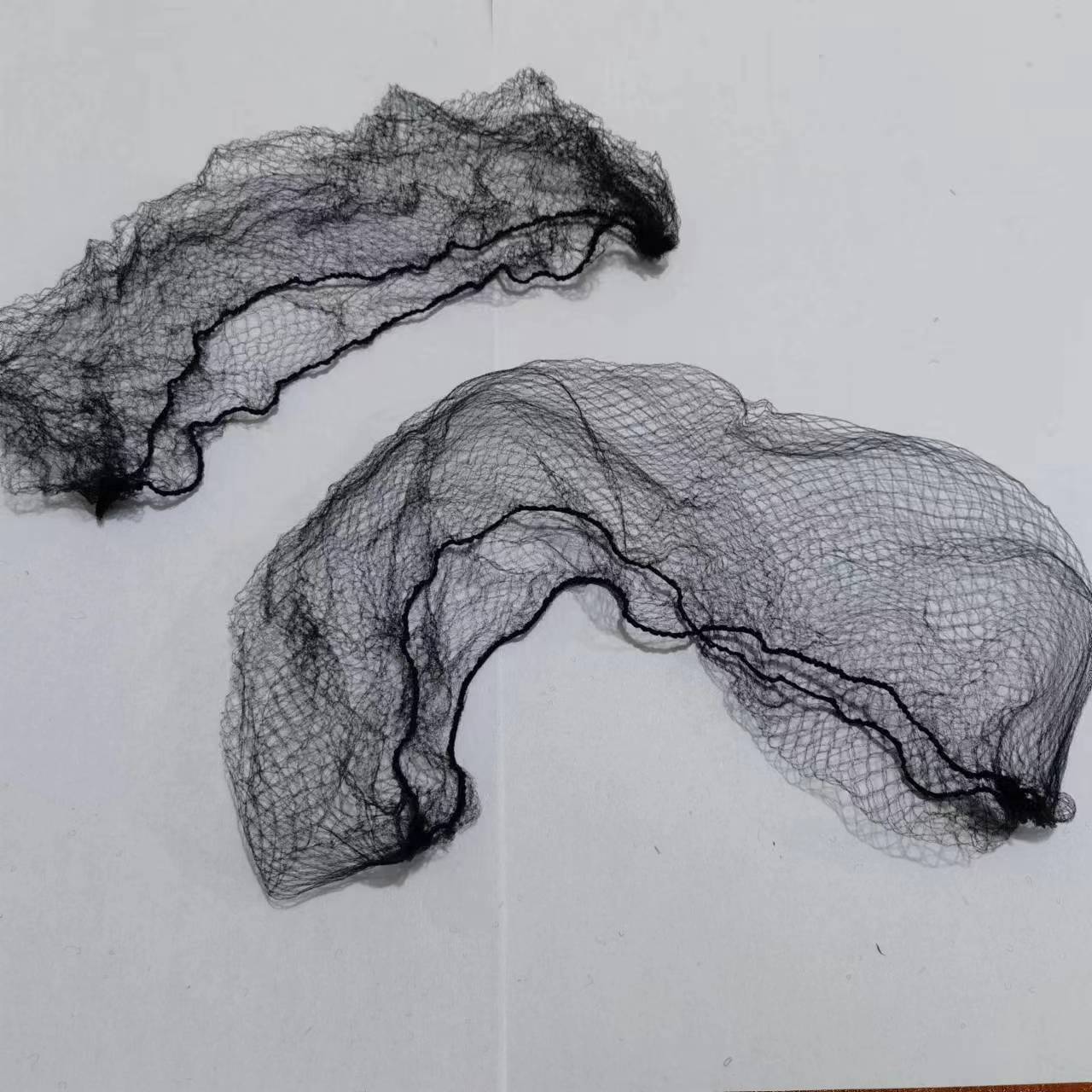 What makes mesh hair nets easy to adjust?
