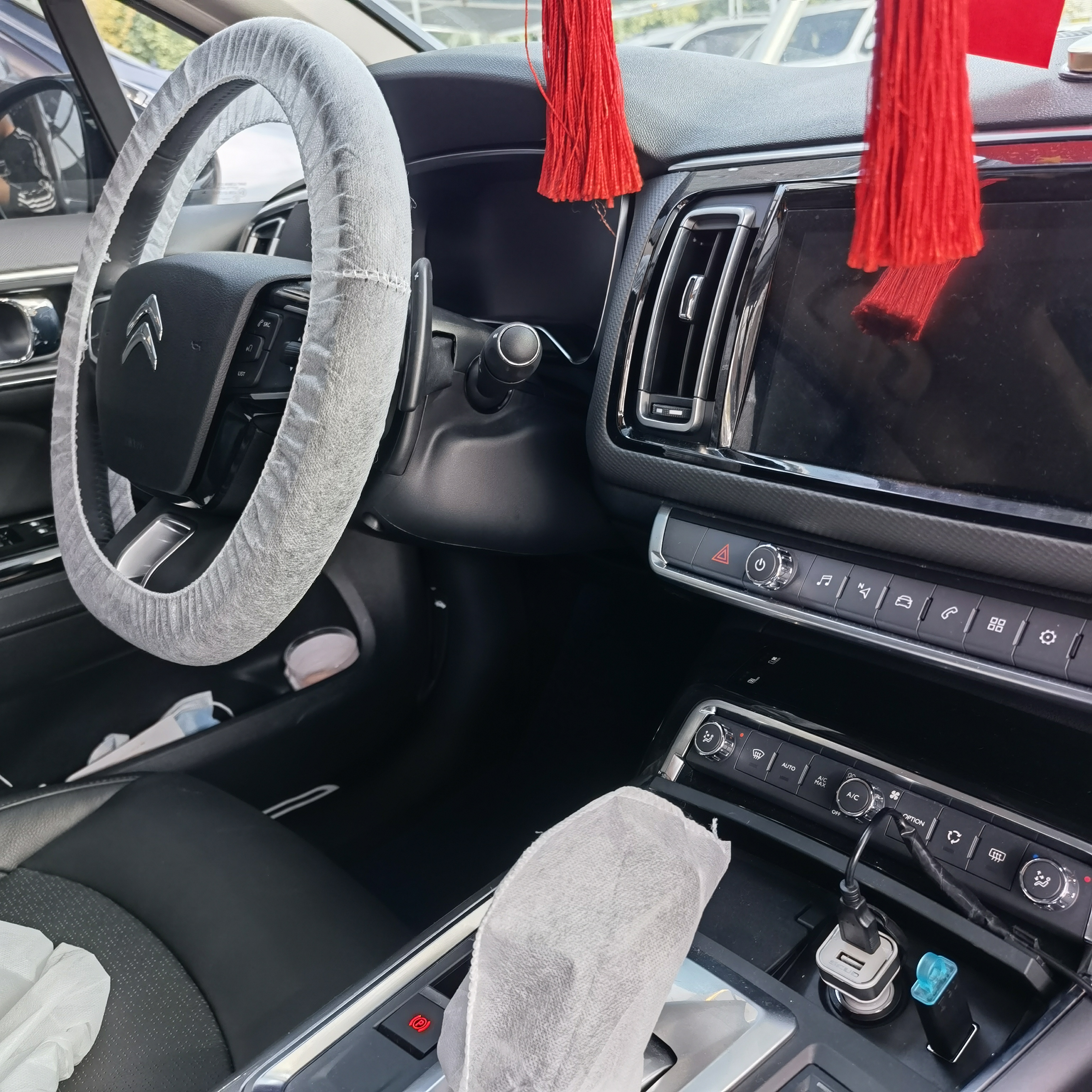 Adjust disposable gear knob cover for a tight fit.