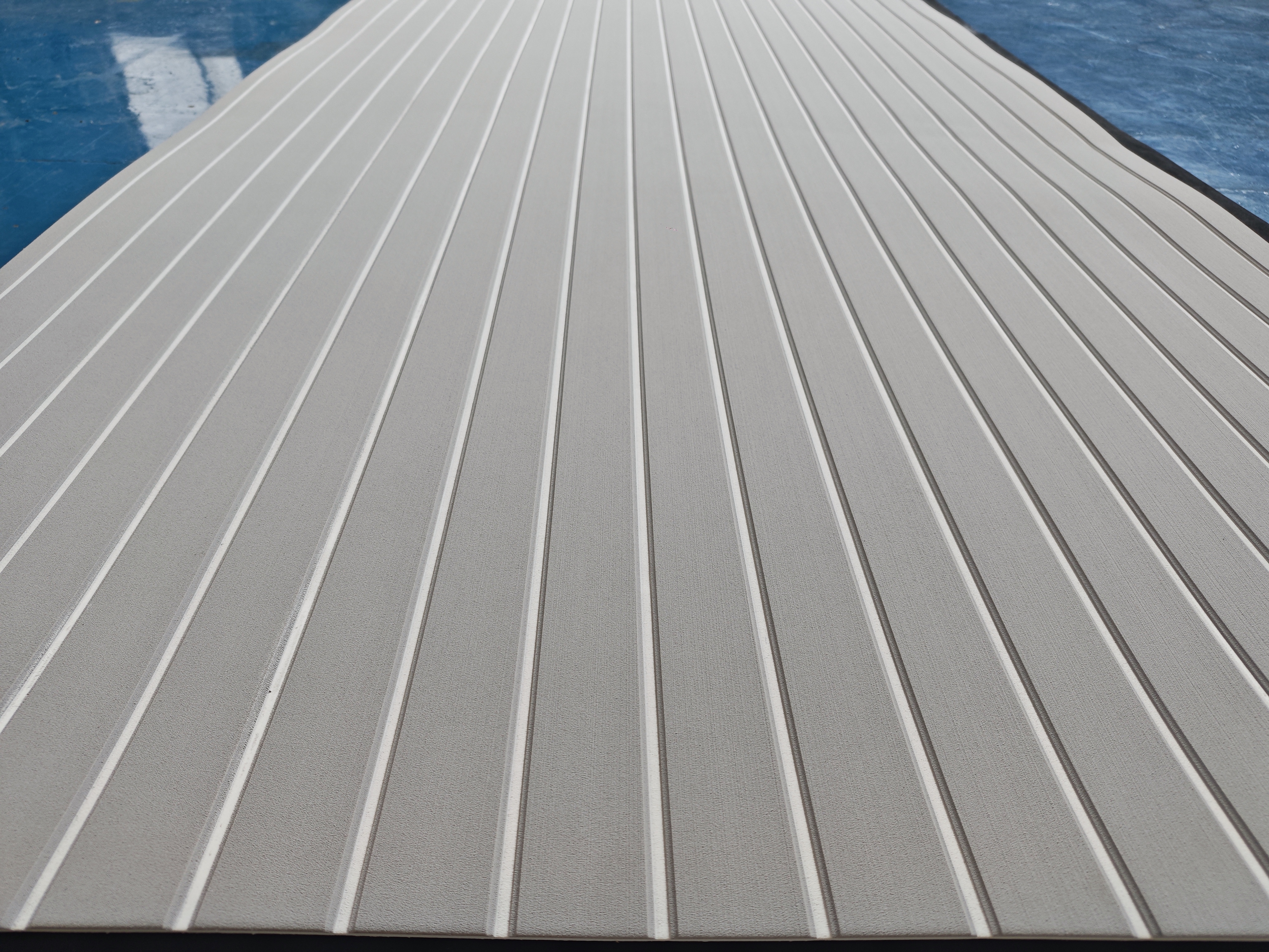 Showcase of off-white, teak-look EVA marine decking sheets.jpg