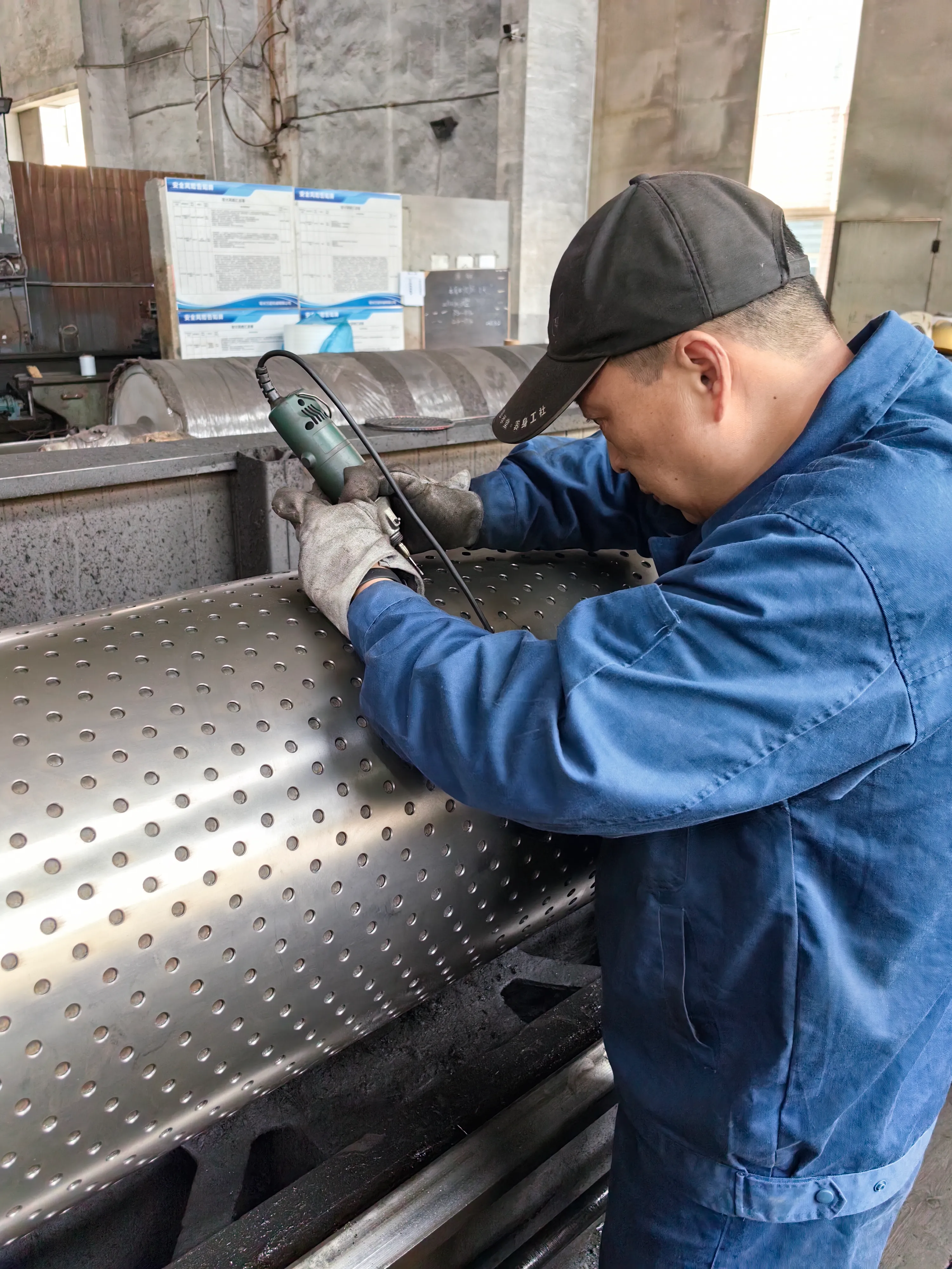 technician manually finishing custom car mat roll mold