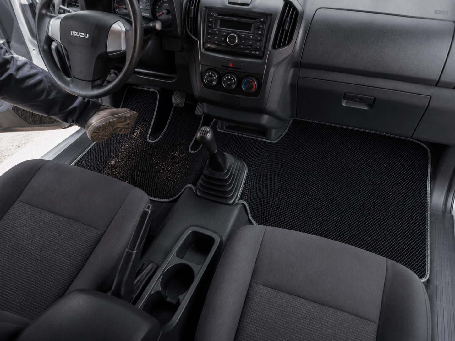 truck floor mat protecting cabin from dirt and debris.png