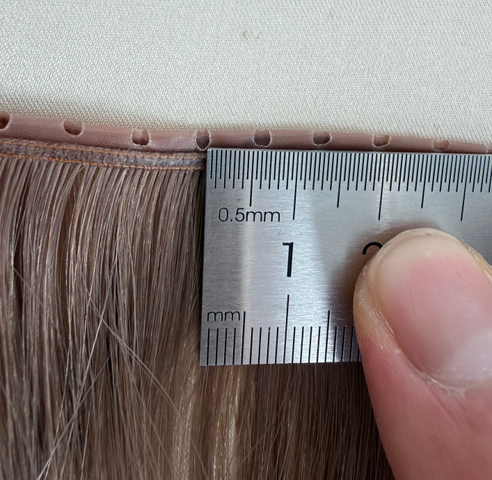 Approved hair extension sample compared with bulk production units.JPG