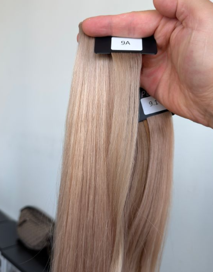 Technician measuring hair extension attachment dimensions